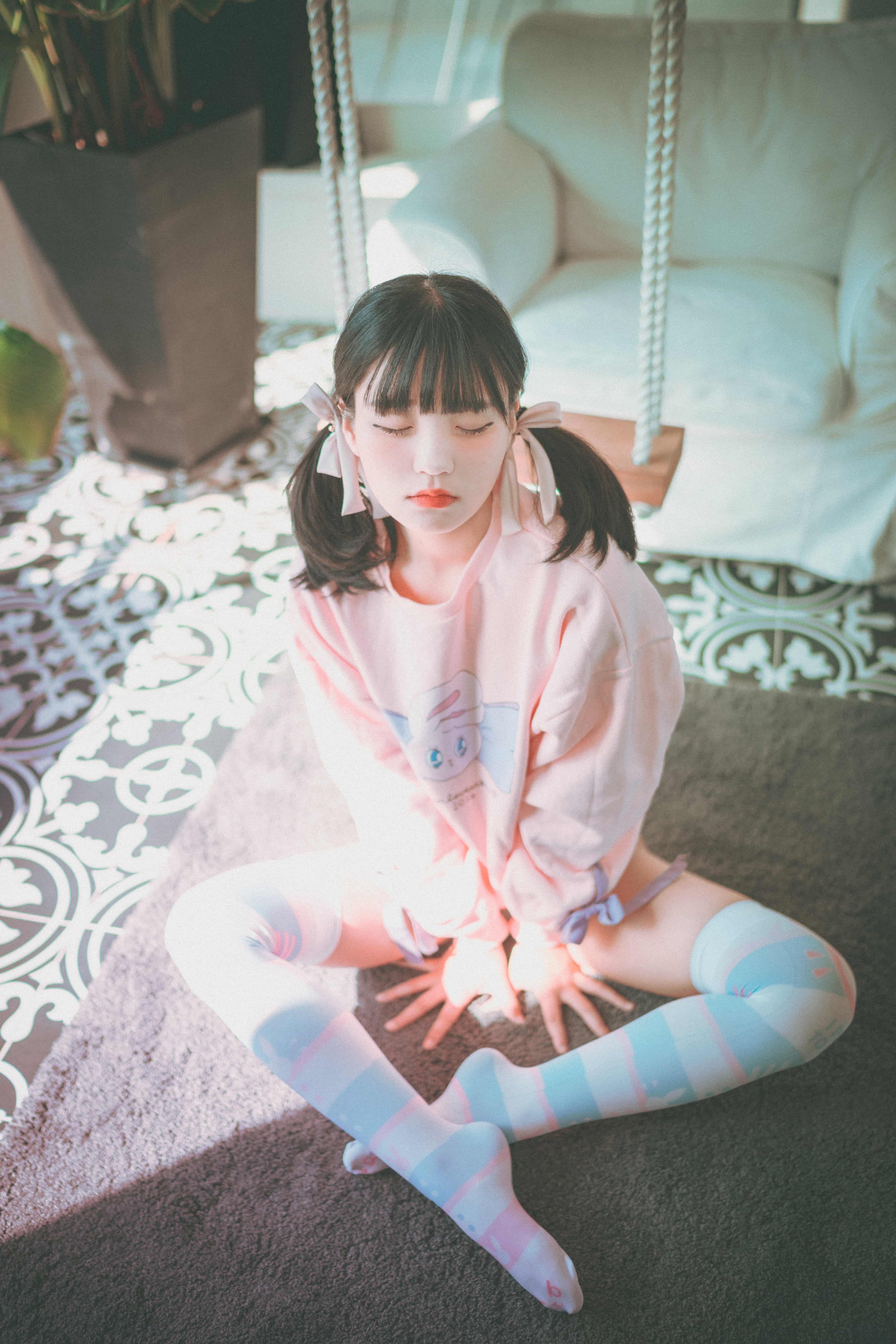 Soft portrait of bare soles peeking from pink hosiery, highlighting gentle curves and nylon sheen on the skin.